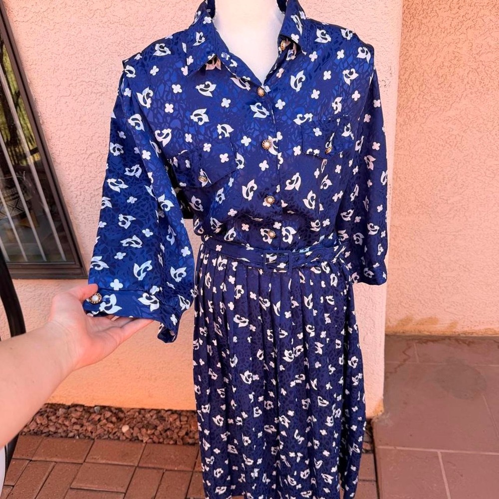Vintage Blue and white floral print button up dress with belt.